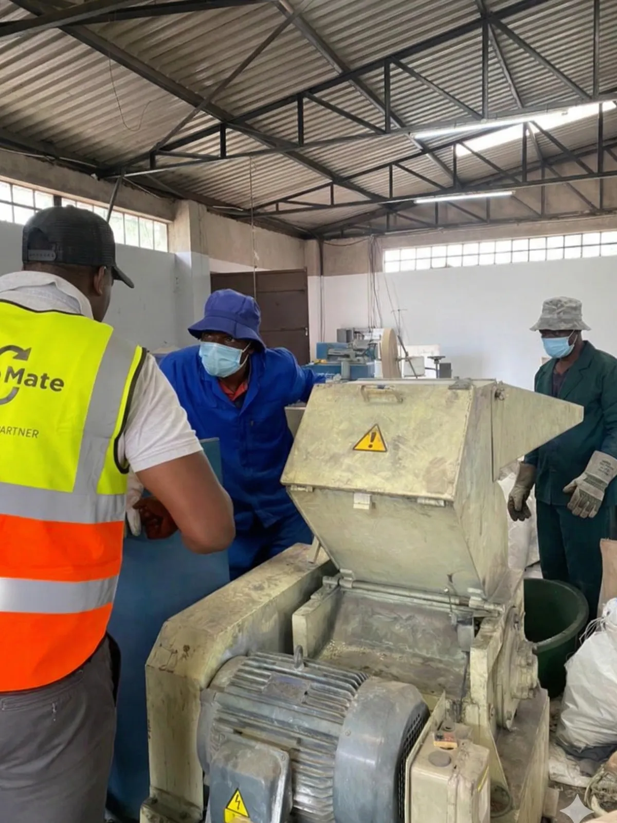 WasteMate team operating recycling machinery